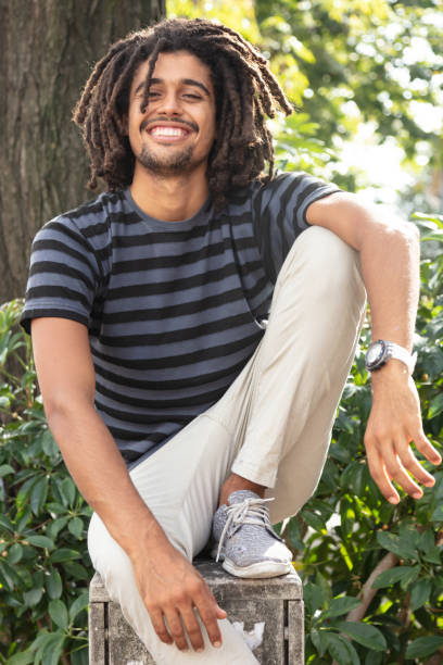 istock Relaxed casual rastafarian outside looking at camera smiling 1045462540