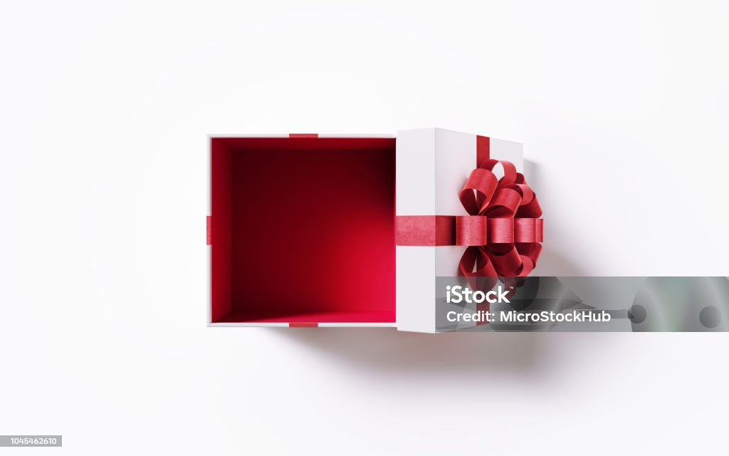 Caja de regalo blanca abierto atada con cinta roja sobre fondo blanco - Foto de stock de Caja de regalo libre de derechos