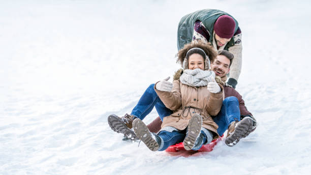 istock Group of friends tobogganing 1045465570