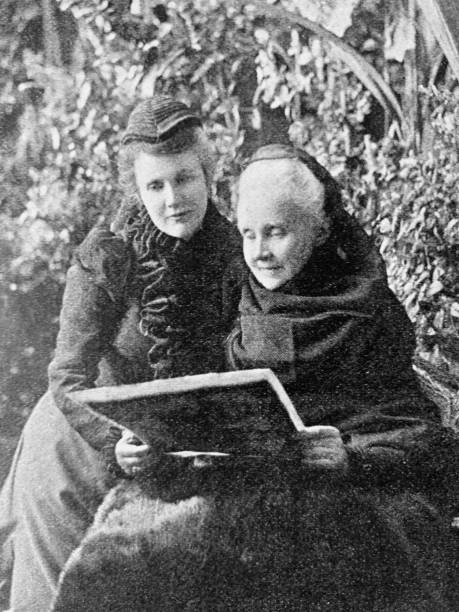 istock Mother and daughter reading in the garden 1045467196