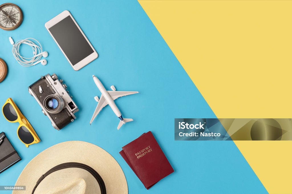 Travel accessories flat lay with copy space High angle view of travel accessories on the blue/yellow background with copy space Travel Stock Photo