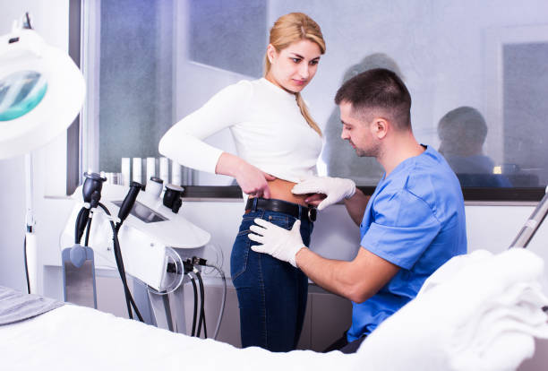 istock cosmetologist examining female body before procedure 1045470264