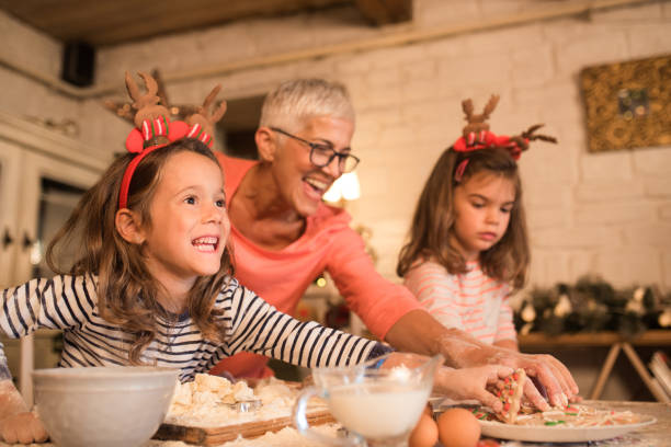 istock Joyful family baking cookies together 1045473436