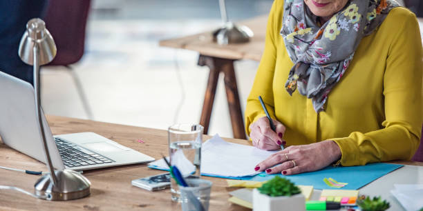 istock Mature woman in the office 1045473516