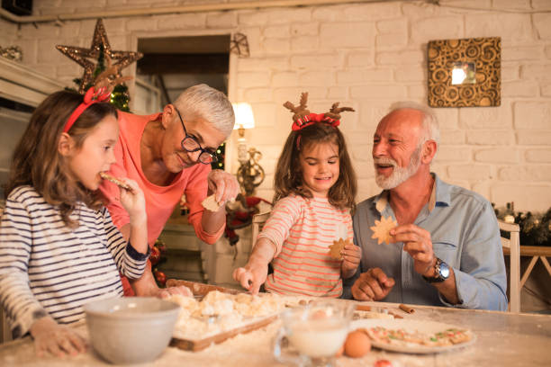 istock Family preparing and eating cookies 1045473644