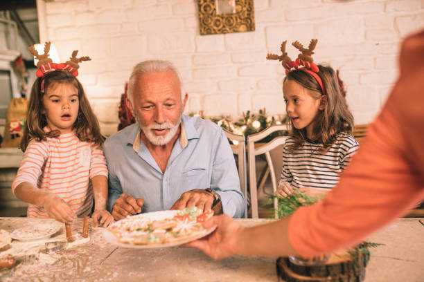 istock Joyful family looking at Christmas cookie plate 1045473968