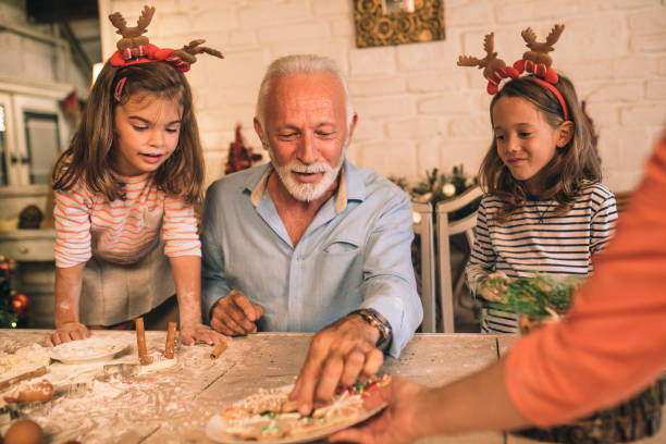 istock Senior man taking Christmas cookie 1045474126