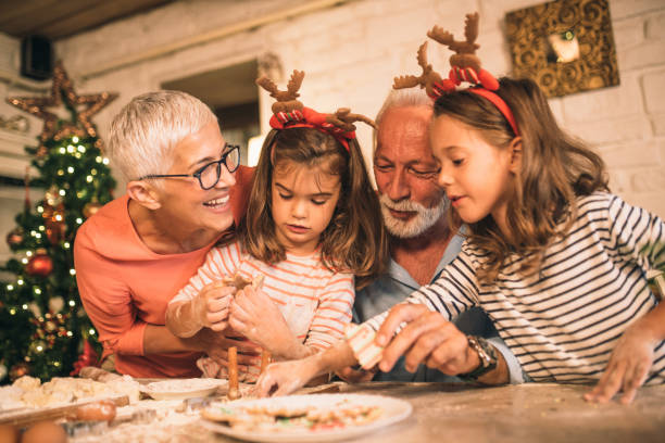 istock Grandparents eating cookies with granddaughters 1045474210