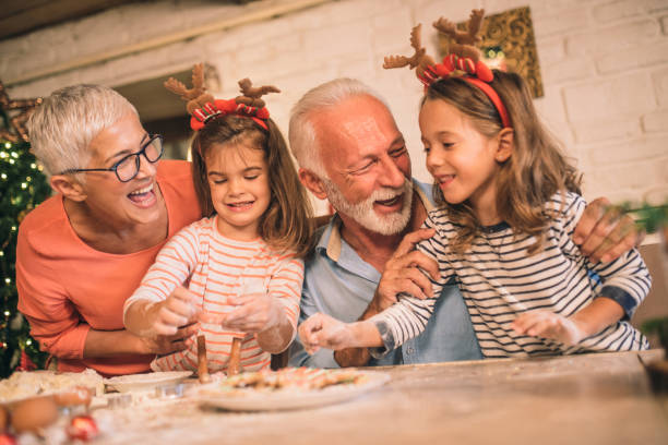 istock Smiling family baking Christmas cookies 1045476270
