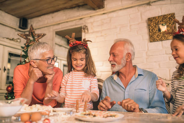 istock Happy old couple with granddaughters 1045476296