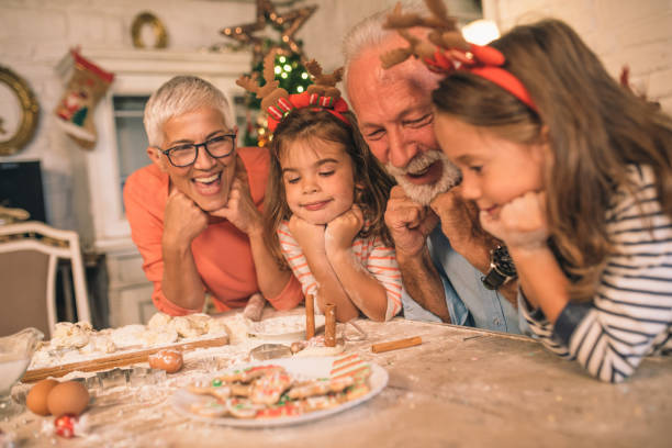 istock Smiling family looking at cookies on the table 1045476410