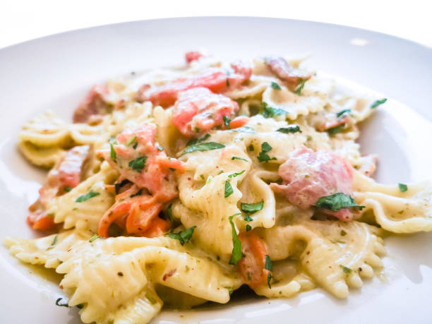 istock tasty pasta with salmon on a the table 1045491038