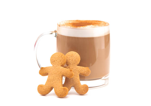 A Gingerbread Latte in a Clear Mug with Cookies on the Side