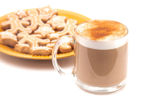 A Gingerbread Latte in a Clear Mug with Cookies on the Side