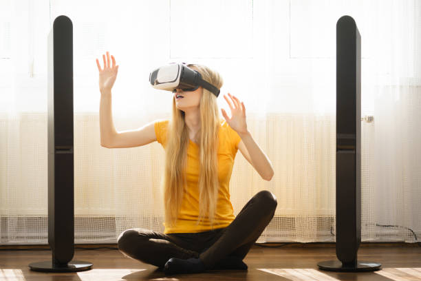 istock Girl wearing virtual reality goggles at home 1045494984
