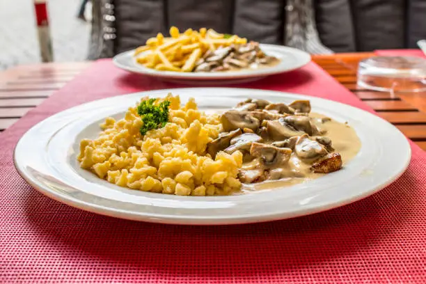 Swabian dinner speciality - Spaetzle with mushrooms