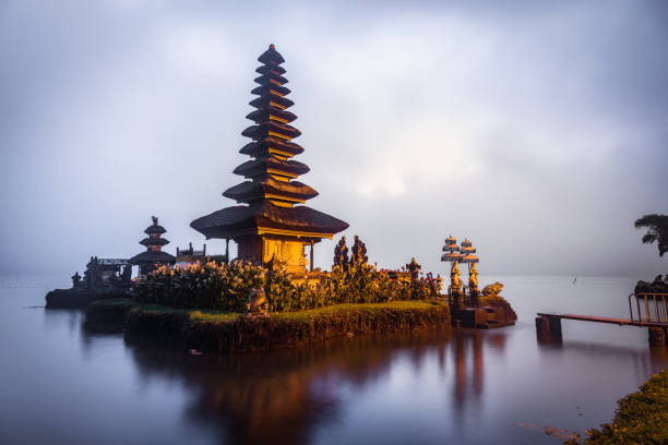 Temple of Bali The floating island balinese temple situated in north bali on a lake with its beautiful architecture floating temple in lake bedugul bali stock pictures, royalty-free photos & images