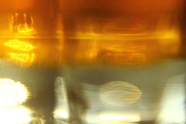 istock Abstract background - light flashes, rays and reflections on Yellow background. Motion blur. 1045496726