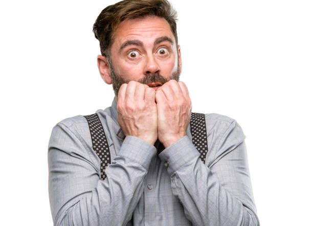 istock Middle age man, with beard and bow tie terrified and nervous expressing anxiety and panic gesture, overwhelmed 1045499726