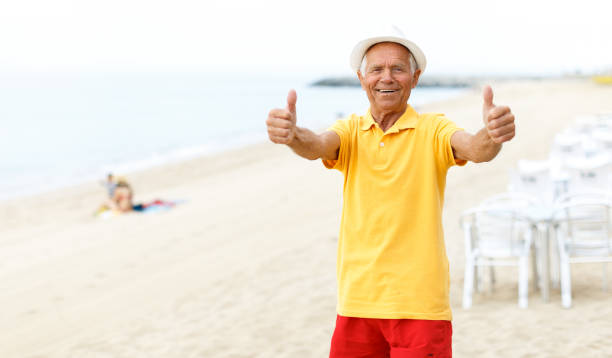 istock Satisfied joyful mature man giving thumbs up 1045500800