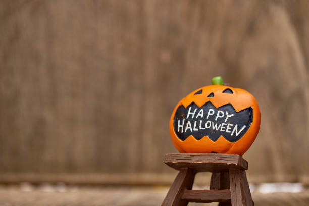 istock Composition for Halloween Pumpkin Toy Decoration on wooden table background 1045501896