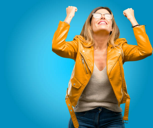 istock happy and excited expressing winning gesture. Successful and celebrating victory, triumphant 1045504234