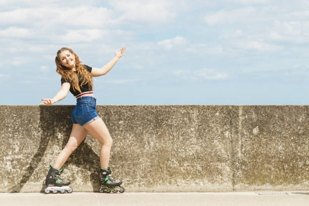 istock Fit girl with roller skates outdoor 1045505172
