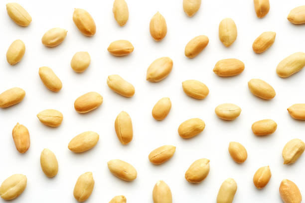 Peanuts pattern isolated on a white backround. Repetition concept. Top view stock photo