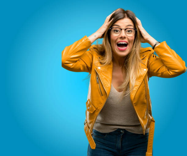 istock happy and surprised cheering expressing wow gesture 1045505412
