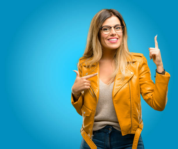 istock happy and surprised cheering expressing wow gesture pointing up 1045505420
