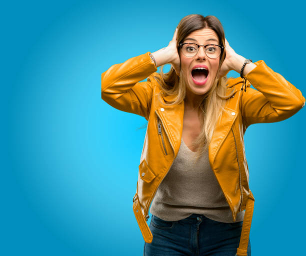 istock happy and surprised cheering expressing wow gesture 1045505422