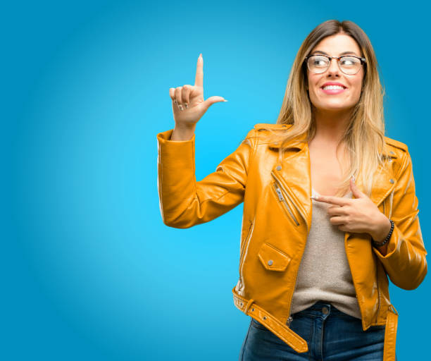 istock happy and surprised cheering expressing wow gesture pointing up 1045505492