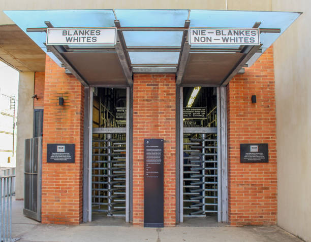 Entrance Apartheid Museum The Apartheid Museum is a museum in Johannesburg, South Africa illustrating apartheid and the 20th century history of South Africa. The museum, part of the Gold Reef City complex, was opened in November 2001. apartheid stock pictures, royalty-free photos & images