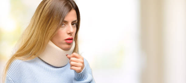 young injured woman wearing neck brace collar sick and coughing, suffering asthma or bronchitis, medicine concept - throat cold virus pain physical injury imagens e fotografias de stock