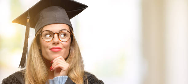 istock Young woman university graduate student thinking and looking up expressing doubt and wonder 1045520788