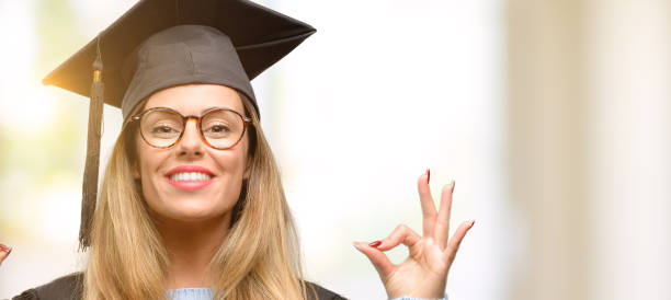 istock Young woman university graduate student doing ok sign gesture with both hands expressing meditation and relaxation 1045520794