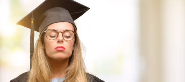 istock Young woman university graduate student with sleepy expression, being overworked and tired 1045523050
