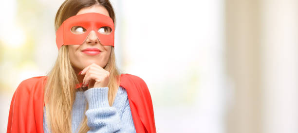 istock Young super woman thinking and looking up expressing doubt and wonder 1045523066