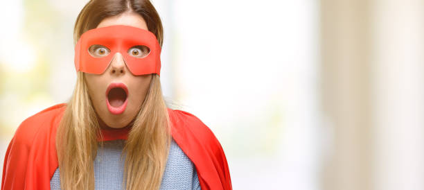 istock Young super woman scared in shock, expressing panic and fear 1045523086