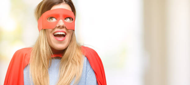 Young super woman thinking and looking up expressing doubt and wonder