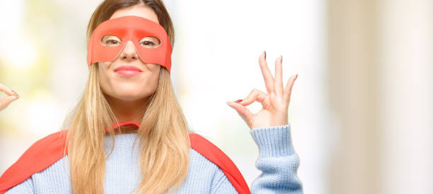 istock Young super woman doing ok sign gesture with both hands expressing meditation and relaxation 1045523178