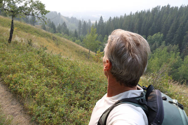 istock View past man's upper torso to trail ahead 1045523750