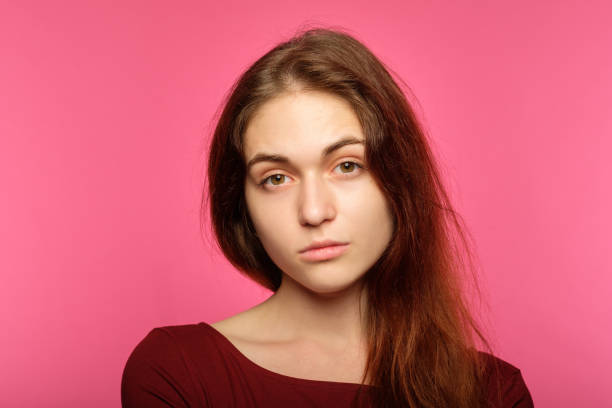 istock poker face lack emotion indifferent cold icy girl 1045529006