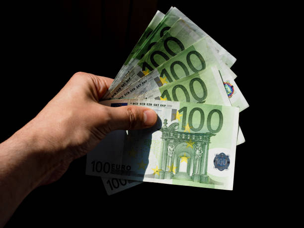 istock Hand with Euro notes, European Union 1045529118