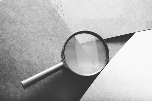 istock magnifier search seek look recruit grey paper 1045529584