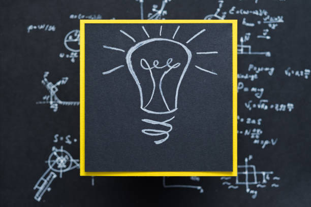 istock lamp eureka illumination breakthrough black paper 1045529620
