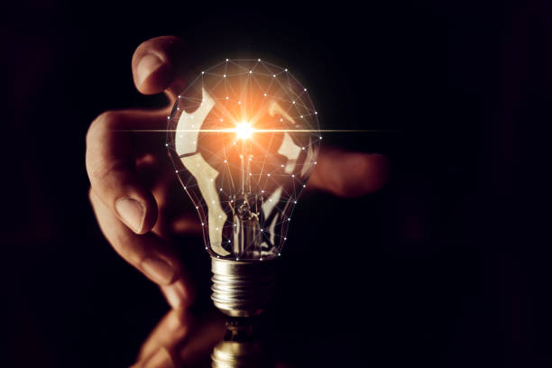 istock man hand choose glow light bulb creativity business ideas concept black background 1045529768