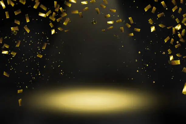 raining gold confetti in spotlight