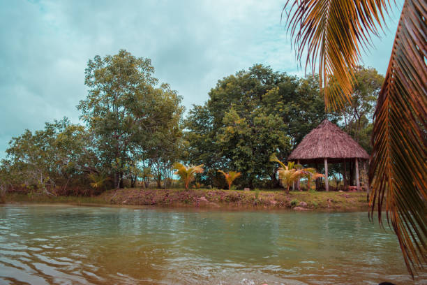 istock Lake, hut, trees and blue sky in Mexico 1045533088