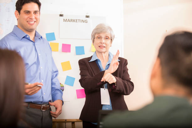 istock Interpreter signing during business meeting. 1045533388